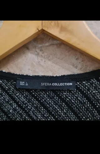 Chaleco crema/negro con toques brillantes