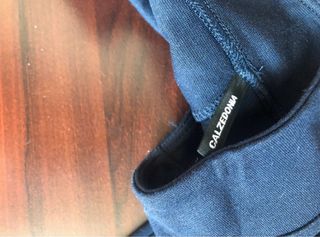 Pantalón azul con flecos