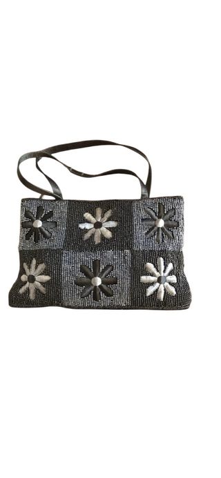 Bolso de fiesta negro con flores