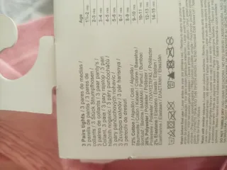 Leotardos infantiles rosas y blancos