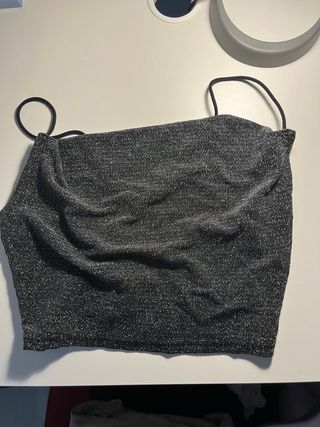 Top fiesta brillante espalda abierta