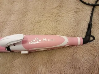 Plancha de pelo rosa y blanca