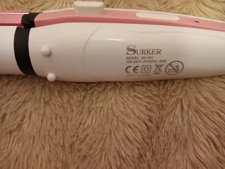 Plancha de pelo rosa y blanca