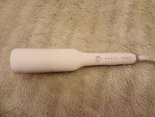 Plancha de pelo rosa y dorada