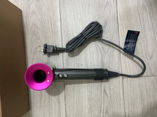 Secador de pelo Dyson gris y rosa