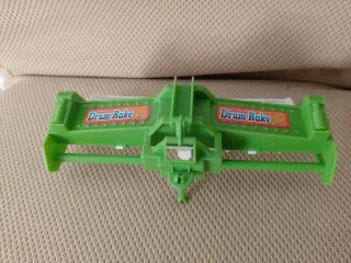 Rastrello a tamburo giocattolo verde