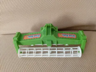 Rastrello a tamburo giocattolo verde