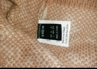 Jersey de punto beige y blanco