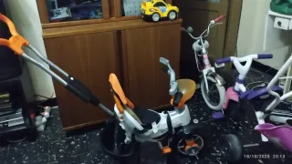 Triciclo infantil morado y rosa