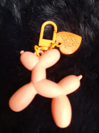 Llavero perro globo naranja