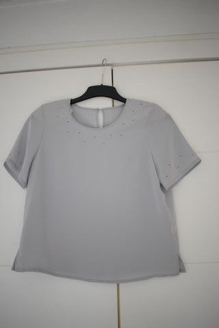 Blusa azul Burberry con ojales