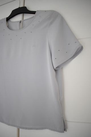 Blusa azul Burberry con ojales