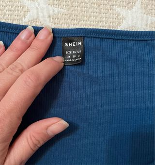 Camiseta azul manga larga con botones