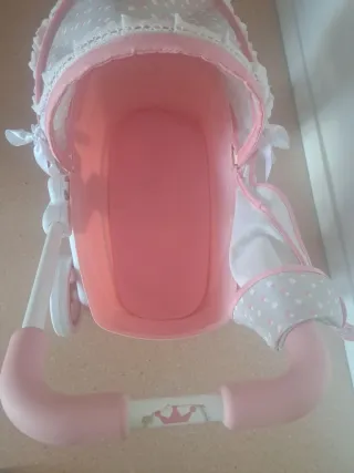 Carrito de bebé rosa y gris