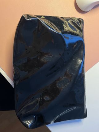 Neceser Primark PVC negro brillante con lazo