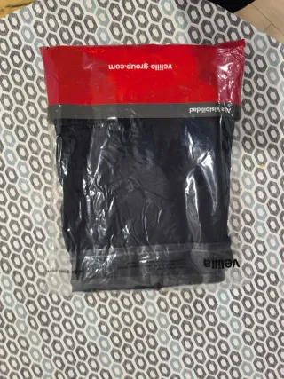 Chaqueta de trabajo naranja y azul y pantalón azul