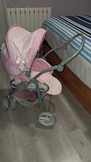 Carrito de muñecas rosa