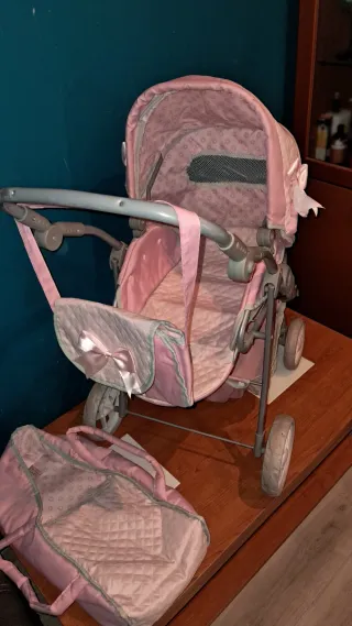 Carrito de muñecas rosa
