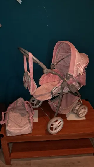 Carrito de muñecas rosa
