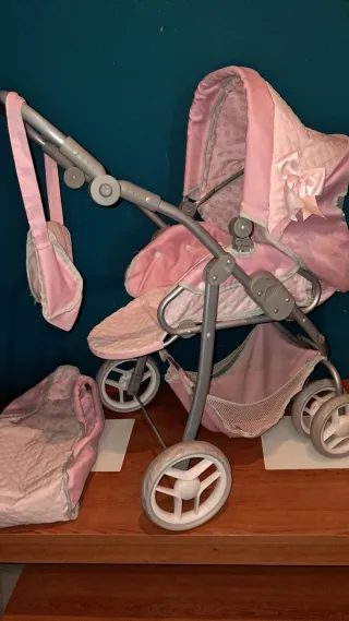 Carrito de muñecas rosa