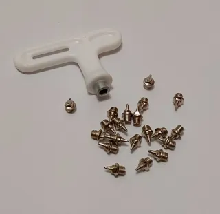 Zapatillas clavos rosas.