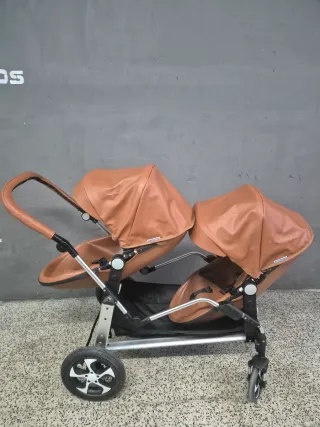 Cochecito gemelar marrón