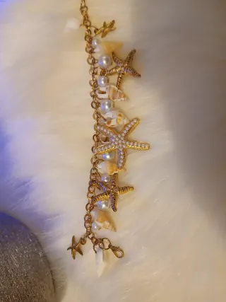 Braccialetto con stelle marine e perle