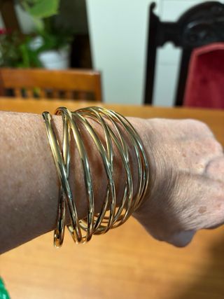 Bracciale rigido intrecciato in metallo color oro