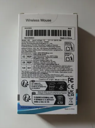 Ratón de ordenador inalámbrico en su caja