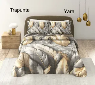 Trapunta con disegno piuma oro e grigio