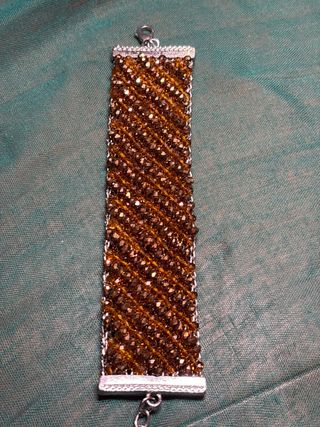Pulsera de cuentas marrón y dorada de swaroski