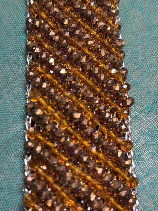 Pulsera de cuentas marrón y dorada de swaroski