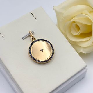 Colgante oro 18kt con zafiros y diamante relicario