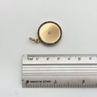 Colgante oro 18kt con zafiros y diamante relicario