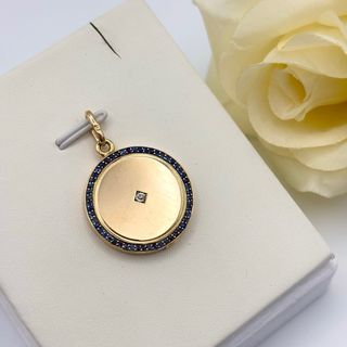 Colgante oro 18kt con zafiros y diamante relicario