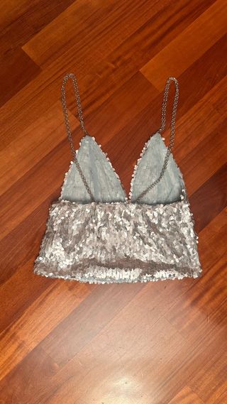 Top paillettes argento con catena