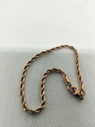 Bracciale in oro rosa con catena e maglie attorcigliate