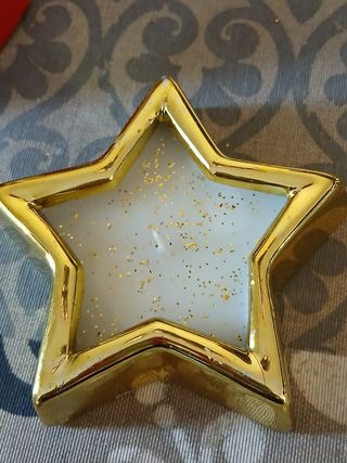Due portacandele con forma di campana e stella