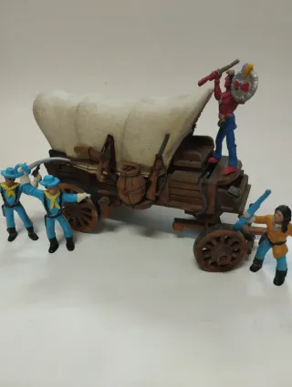 Carreta artesanal con figuras vaqueros e indios