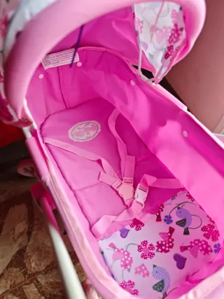 Carrito de muñecas rosa