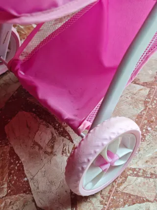 Carrito de muñecas rosa