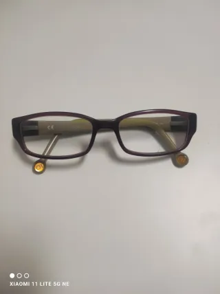 Gafas Carolina Herrera Morado y Dorado