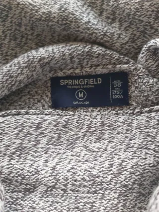 Jersey gris cuello alto con cordón