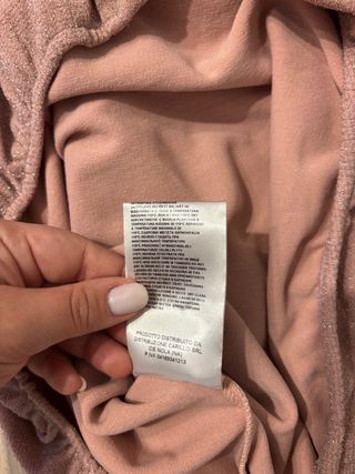 Maglia Artigli S rosa brillantinosa. Scollo ampio.