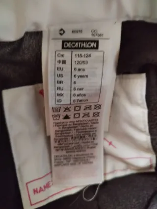 Pantalón de esquí blanco con cremalleras rosas