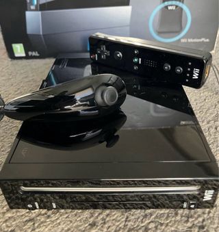 Consola Wii con Caja, accesorios 8 Juegos y más.