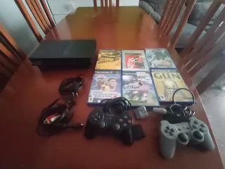 PS2 con 2 mandos y 6 juegos