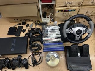 Consolle PlayStation 2 con giochi e accessori