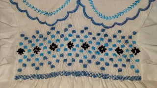 Buzo bebé 9-12 meses bordado a mano.