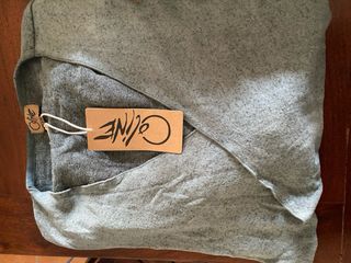 Chaqueta cárdigan verde asimétrica